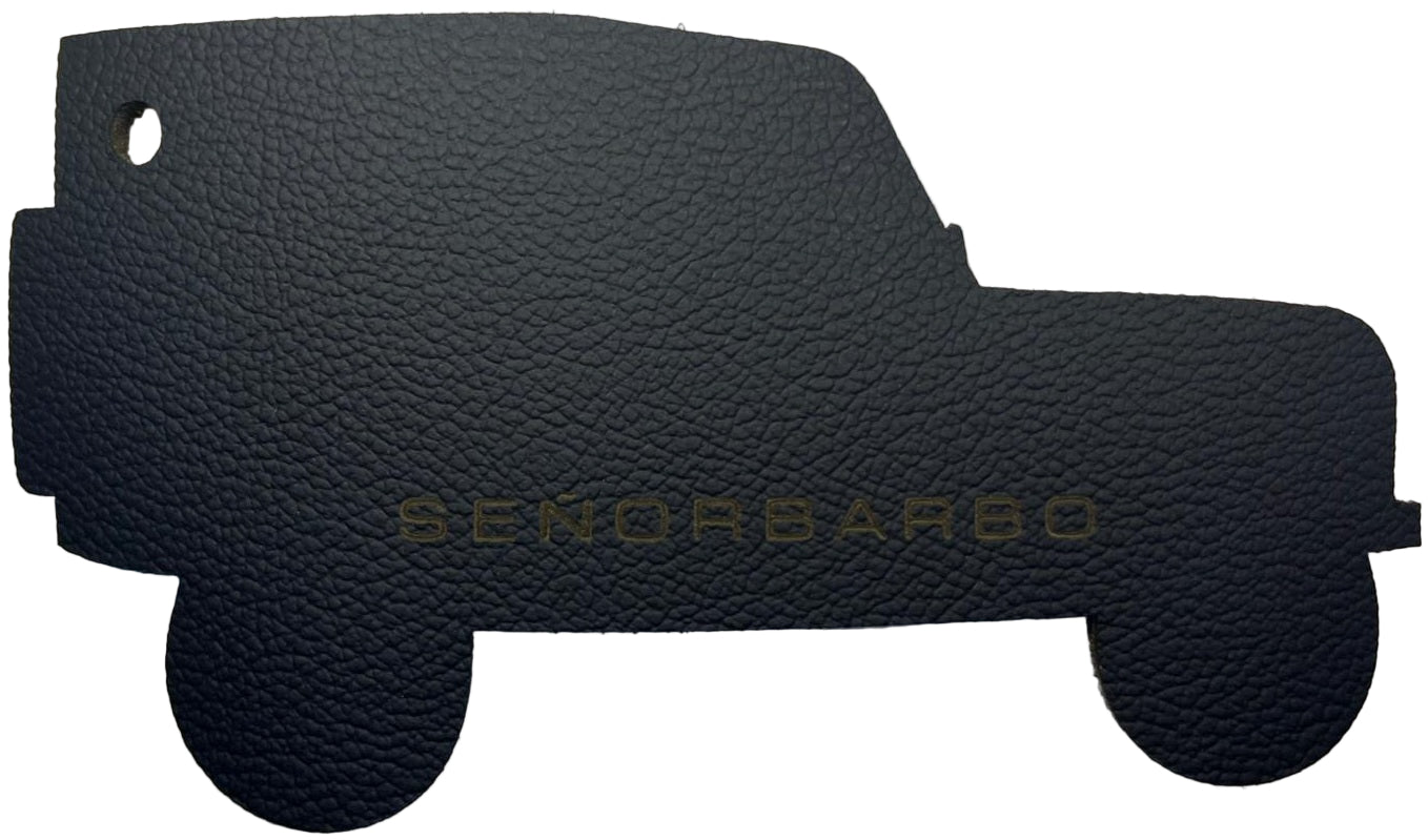 Black textured car mat with &#39;SENORBARBO&#39; branding on a white background
