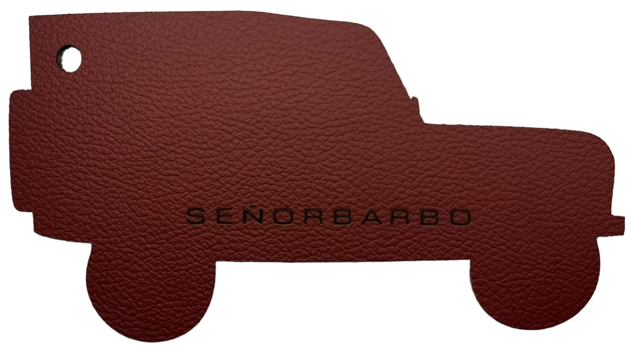 Brown leather car mat with &#39;SenorBarbo&#39; branding on a white background