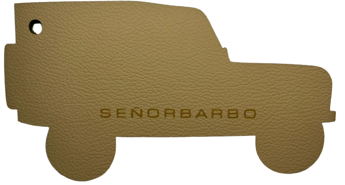 Brown leather car mat with &#39;SenorBarbo&#39; branding on a white background