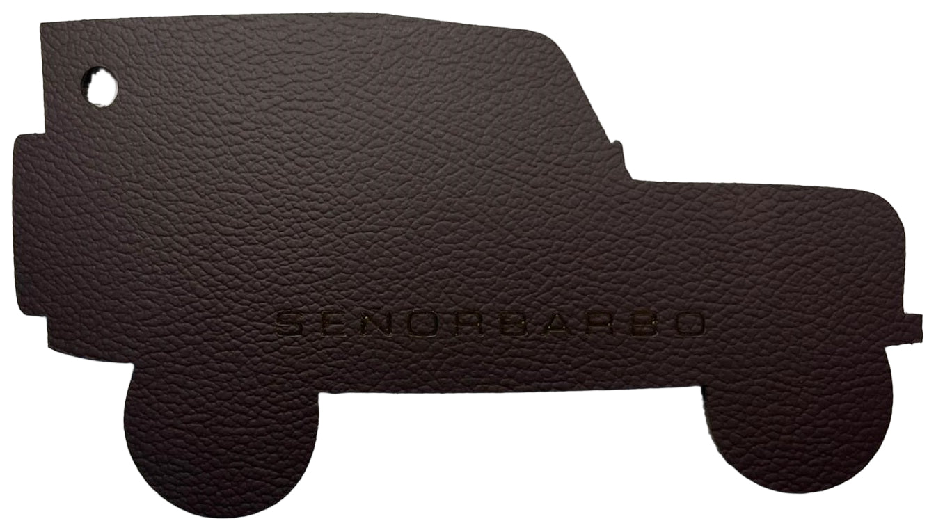 Brown leather car mat with &#39;Senor Barbo&#39; branding on a white background