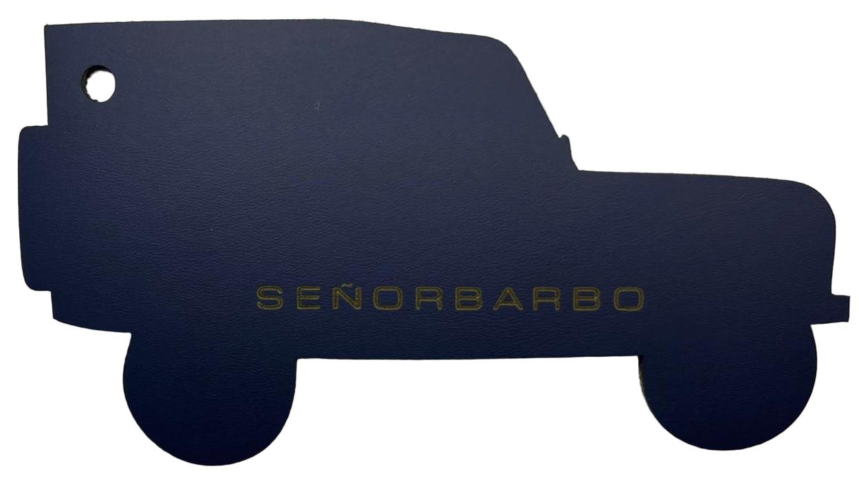 Navy blue car-shaped object with &#39;SEÑORBARBO&#39; text on a white background
