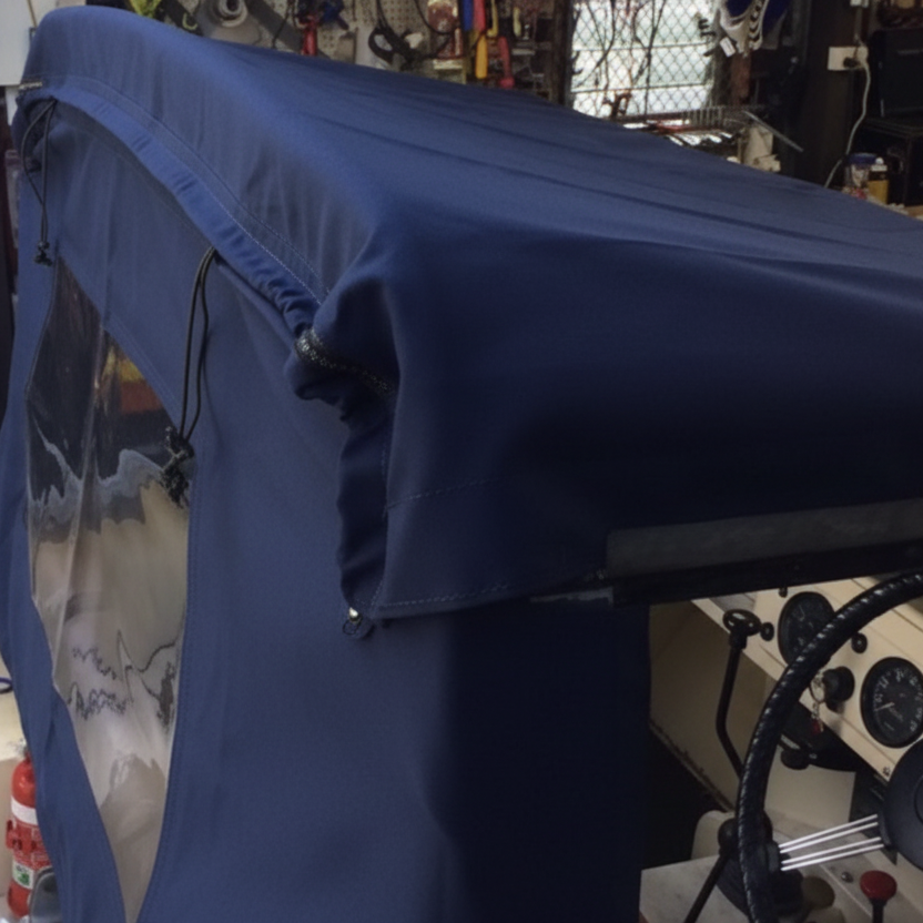 Navy blue cover on a boat in a workshop setting