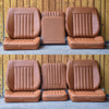 Set of brown leather car seats against a wooden background
