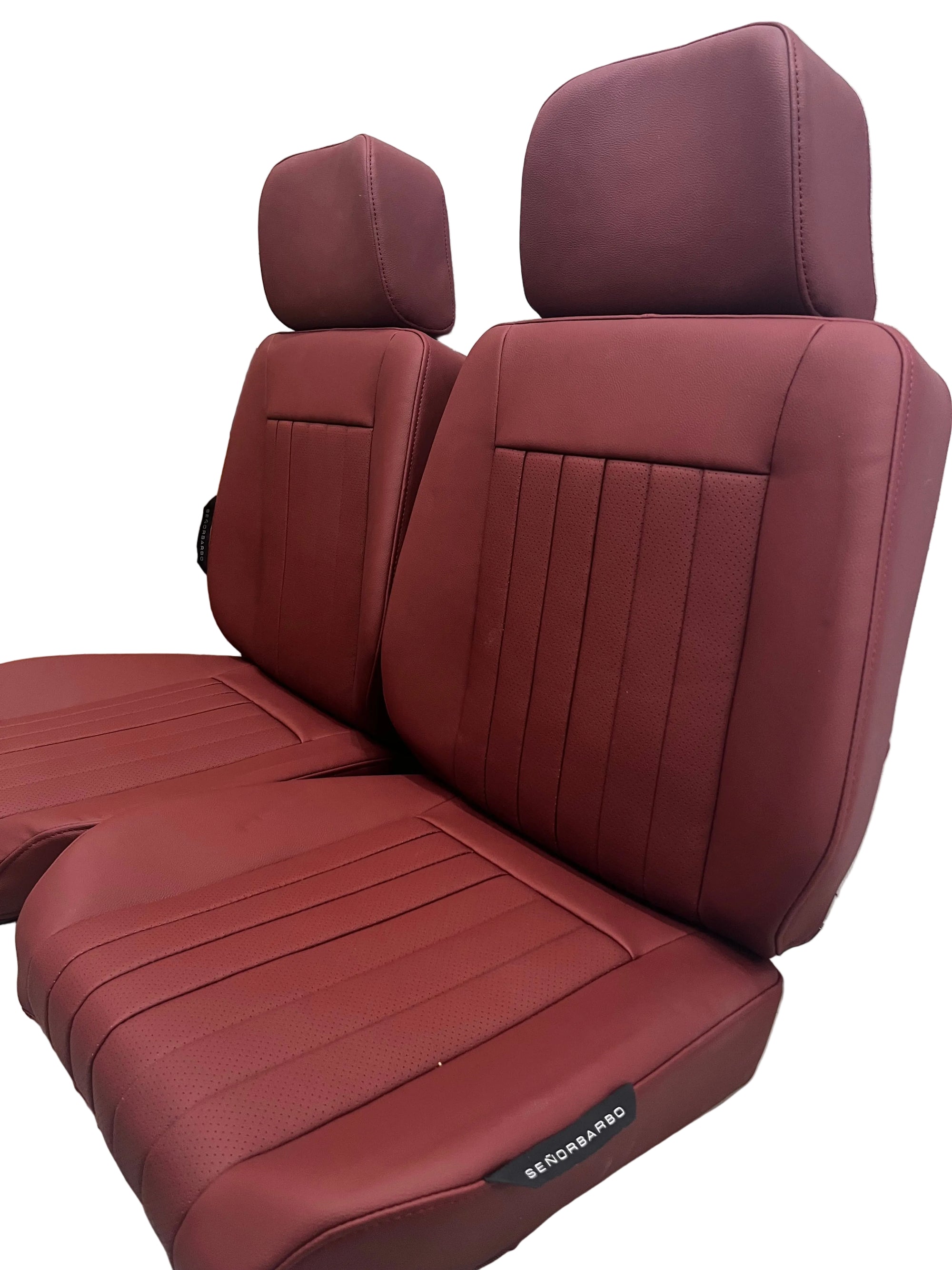 Brown car seat covers on a wooden floor with a white wall background