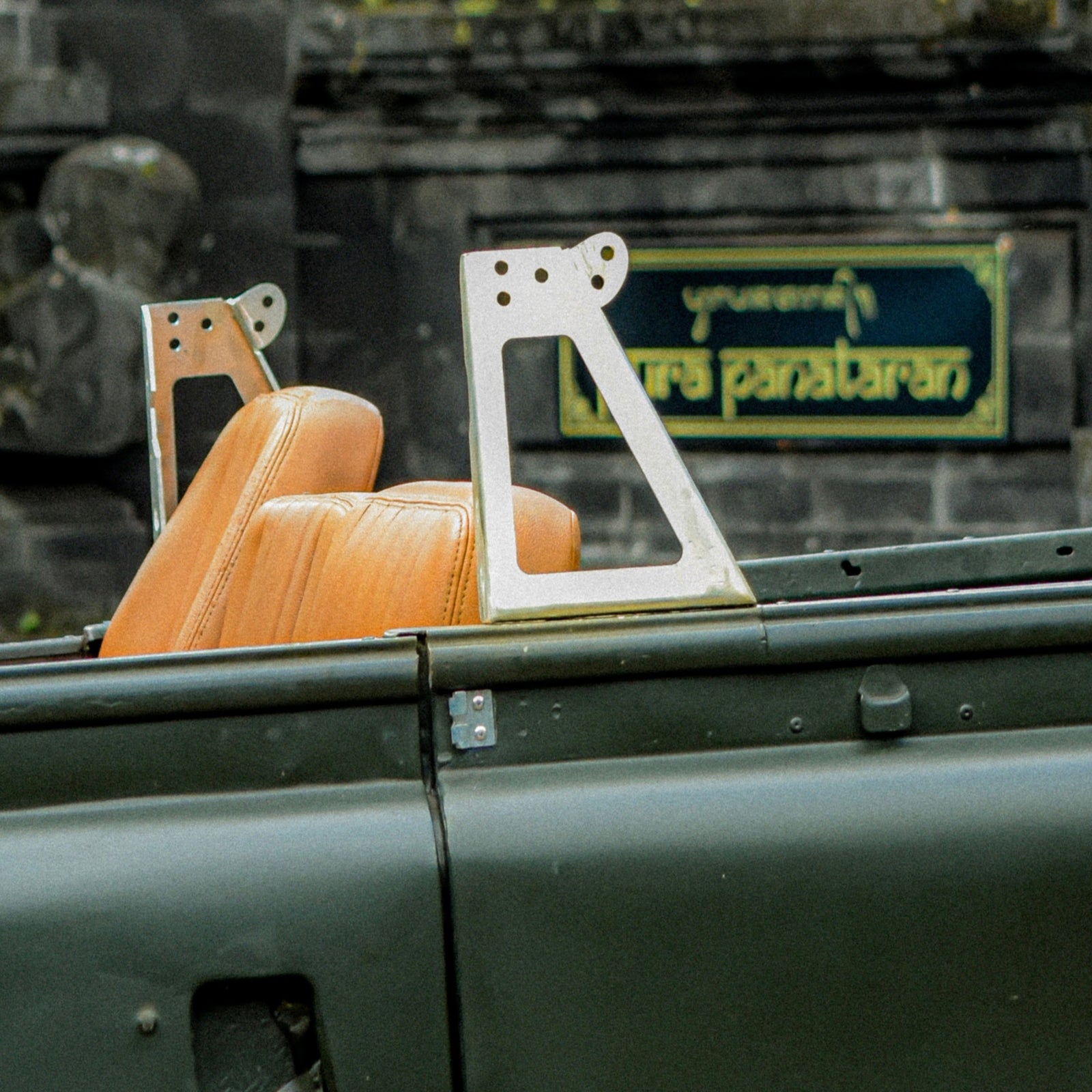 Close-up of a car seat and dashboard with a blurred background