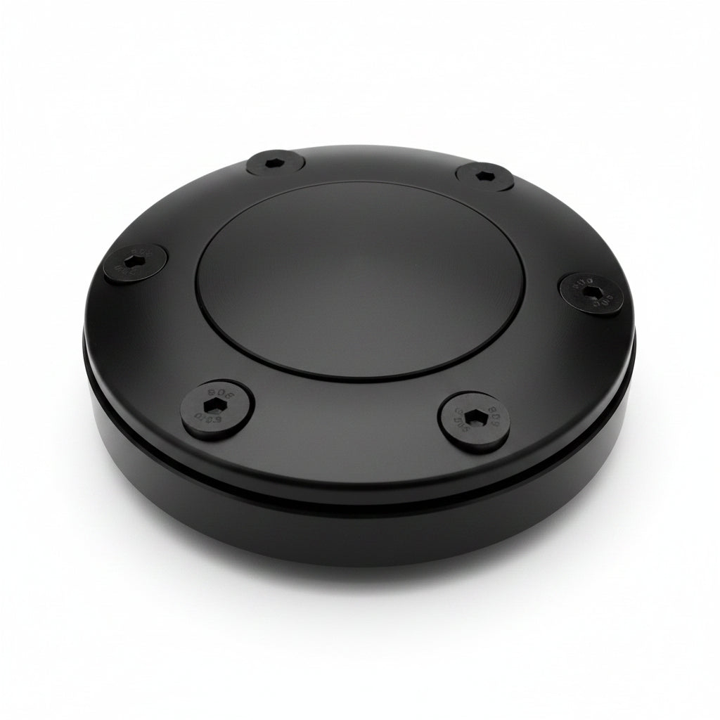 Round metallic object with six screws on a white background