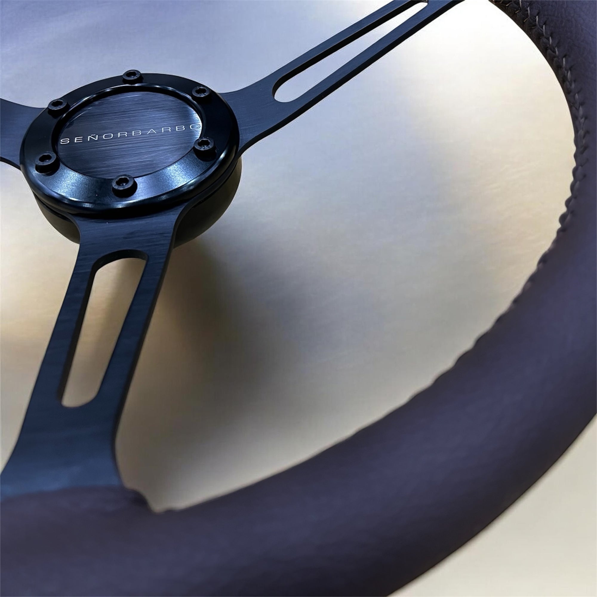 Close-up of a black propeller with 'Benno &amp; Bero' branding on a metallic surface.