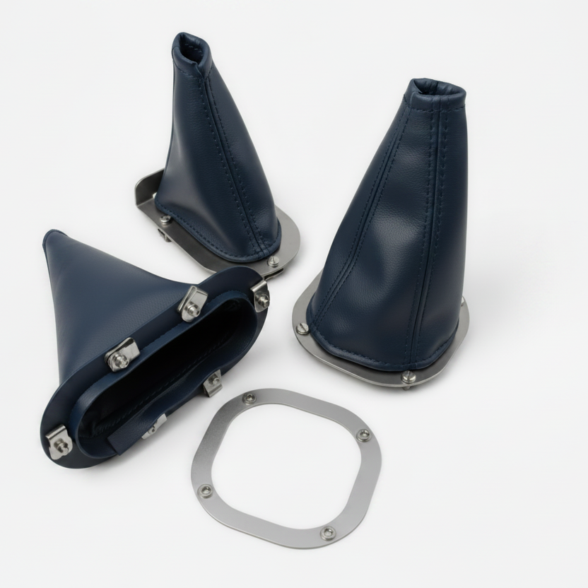 Set of blue leather gear shift boot covers with metal hardware on a white background