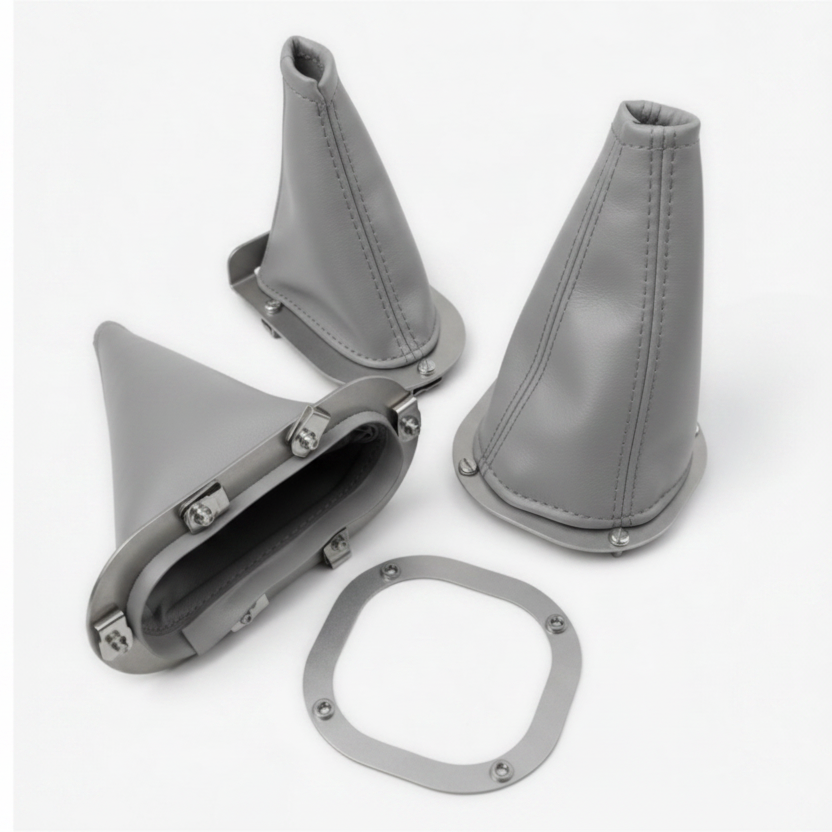 Set of gray leather gear shift boot and shifter on a white background