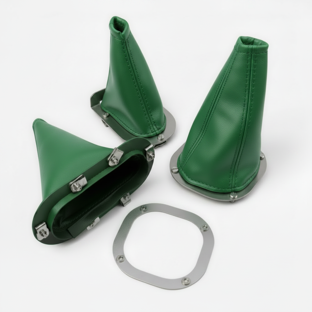 Green leather gear shifter boot set with metal flange on a white background