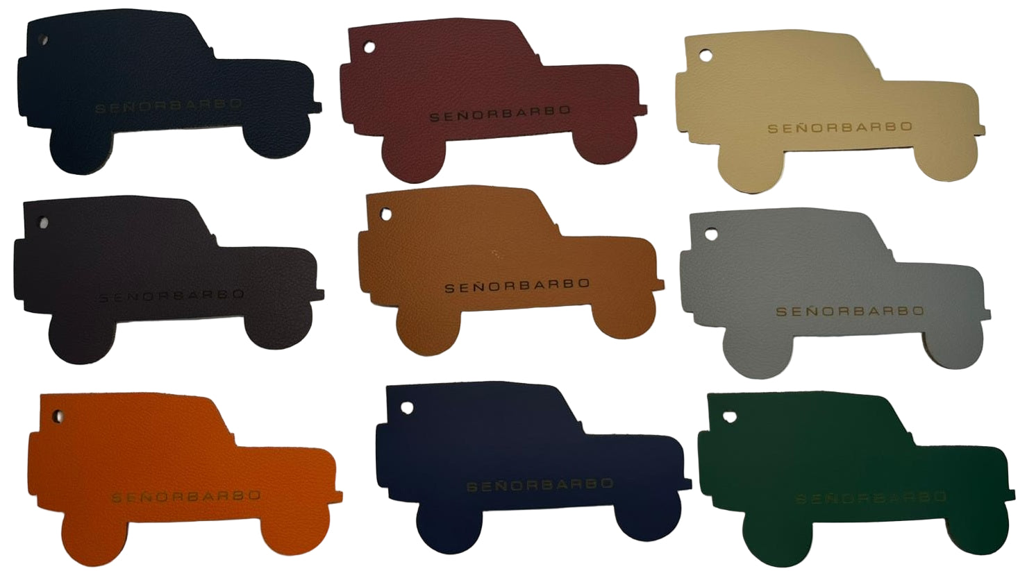 Set of nine truck-shaped keychains in different colors on a white background