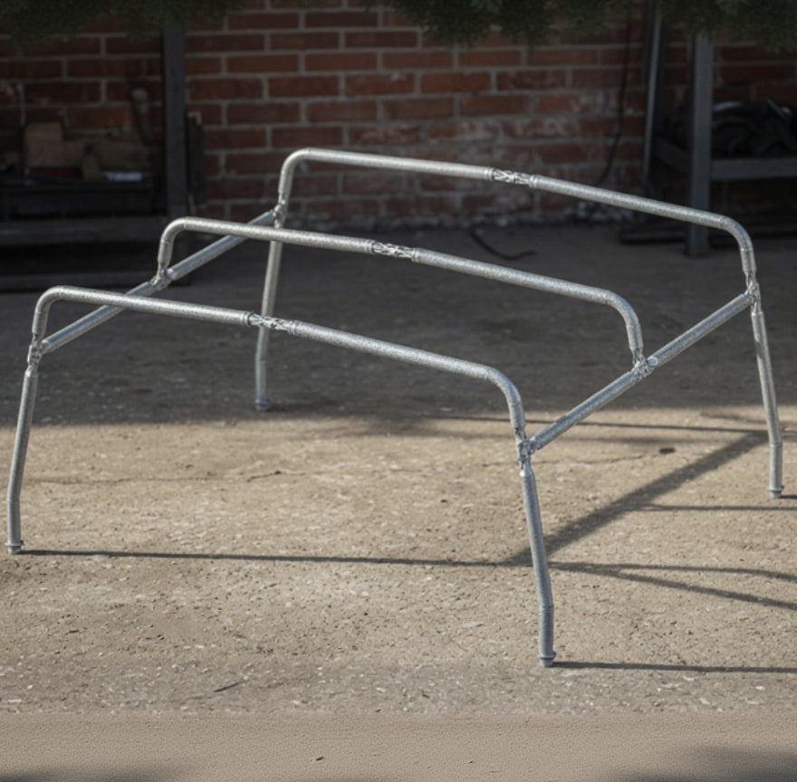 Metal agility hurdles on a concrete floor with a brick wall background